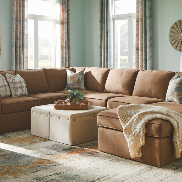 Cozy living room with a modular sectional sofa, soft lighting, and earthy tones.