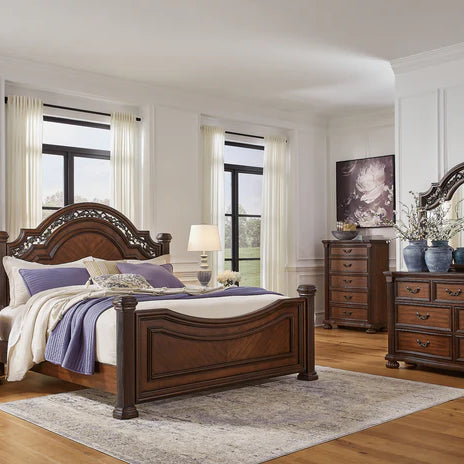 A cozy and stylish bedroom with a queen bed set, featuring soft lighting, plush bedding, and warm earthy tones, reflecting a community-focused brand aesthetic.