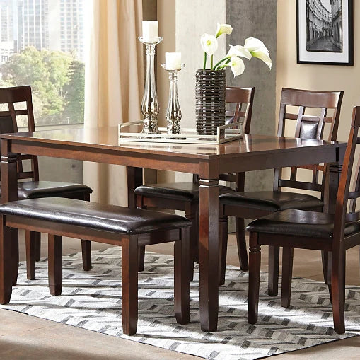 Warm and inviting dining room scene with a stylish table set, bench, chairs, and subtle southeastern U.S. style elements.