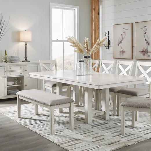 A cozy dining room with a stylish table and bench set, bathed in natural light, reflecting modern and traditional styles.