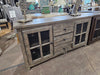 Entertainment Center in weathered gray color. Shelf with 3 drawers and 2 doors wit