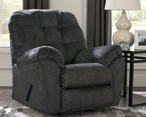 Looking for the perfect blend of decadent comfort and contemporary flair? Feast your eyes on this sensational rocker recliner. Tufted box cushioning and thick pillow top armrests brilliantly merge style and a sumptuous feel. Wonderfully plush to the touch, the recliner's granite gray fabric is the ultimate choice for a chic, trendy look.