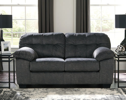 Looking for the perfect blend of decadent comfort and contemporary flair? Feast your eyes on this sensational loveseat. Tufted box cushioning and thick pillow top armrests brilliantly merge style and a sumptuous feel. Wonderfully plush to the touch, the loveseat's granite gray fabric is the ultimate choice for a chic, trendy look.