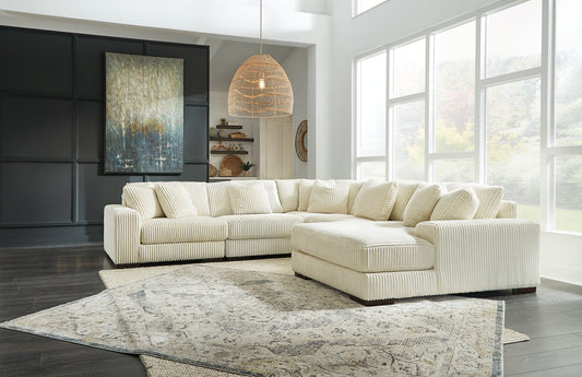 Plush and posh. Showcase your eye for on-trend texture with the statement-making cord upholstery of this sectional with chaise. Its stunningly soft fabric entices in an ivory hue, complementing contemporary color palettes. Sink into the cushions and plan to stay a while—this cozy living room centerpiece highlights your high-end approach to comfort and style.
