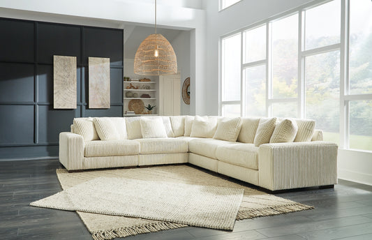 Plush and posh. Showcase your eye for on-trend texture with the statement-making cord upholstery of this sectional. Its stunningly soft fabric entices in an ivory hue, complementing contemporary color palettes. Sink into the cushions and plan to stay a while—this cozy living room centerpiece highlights your high-end approach to comfort and style.