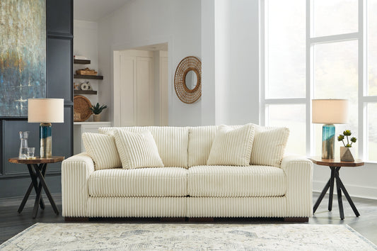 Plush and posh. Showcase your eye for on-trend texture with the statement-making cord upholstery of this sectional loveseat. Its stunningly soft fabric entices in an ivory hue, complementing contemporary color palettes. Sink into the cushions and plan to stay a while—this cozy living room centerpiece highlights your high-end approach to comfort and style.