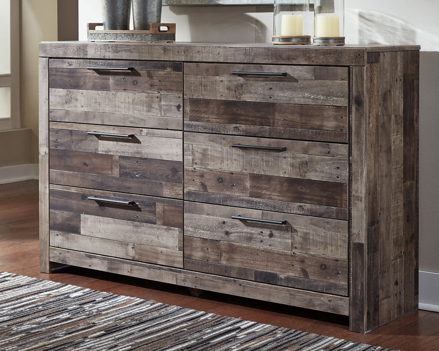 Modern yet hefty. This dresser makes an urban eclectic statement. Seasoned raw wood look merges with the clean lined design we love today. Muted rustic finish over replicated pine grain maintains its authenticity. Roomy drawers are flanked with attractive framed front and pilasters. Handles with antiqued gunmetal finish complete this beauteous look with easy to pull function.