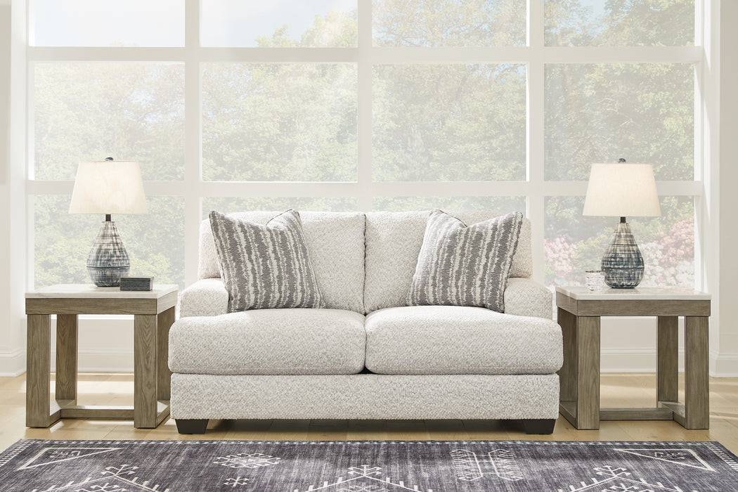This loveseat speaks to those drawn to fresh, contemporary style with richly neutral appeal. Wrapped in a wonderfully plush fabric loaded with multi-tonal interest, this on-trend piece has a warm, welcoming charm. Coordinating accent pillows add to the indulgence. Kick back, relax and settle in for comfort with this cool addition for modern spaces.