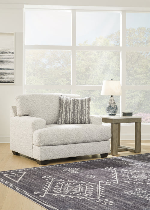 This oversized chair speaks to those drawn to fresh, contemporary style with richly neutral appeal. Wrapped in a wonderfully plush fabric loaded with multi-tonal interest, the on-trend chair has a warm, welcoming charm. Kick back, relax and settle in for comfort with this cool addition for modern spaces.