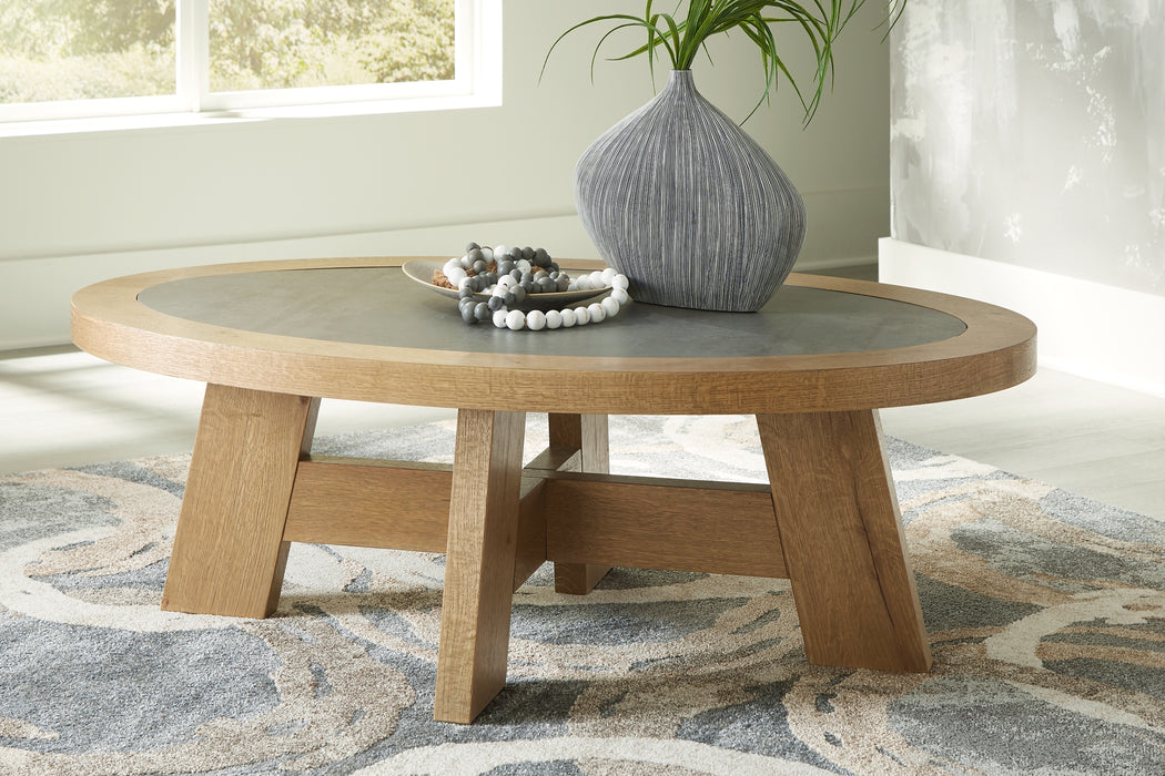 Level up the luxurious feel of your aesthetic at an accessible price. Natural details in the wood elevate the contemporary form of this coffee table. An inset faux cement melamine top adds exceptional beauty and durability. Whether displaying decor or standing solo, it's an elegant approach to everyday style.