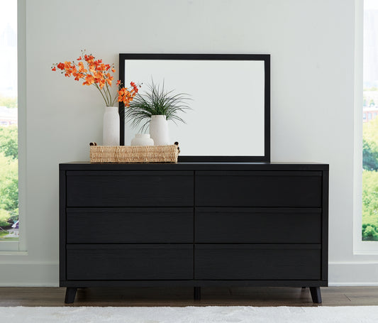 Sophisticated style for the savvy shopper. This dresser with mirror prioritizes affordable, on-trend design. Its subtle replicated texture recalls the natural beauty of wood, highlighting the slatted styling. And a matte black finish savvily suits different approaches to modern aesthetics. Mix and match with light and bright hues, or pair with other dark tones for a moody look.